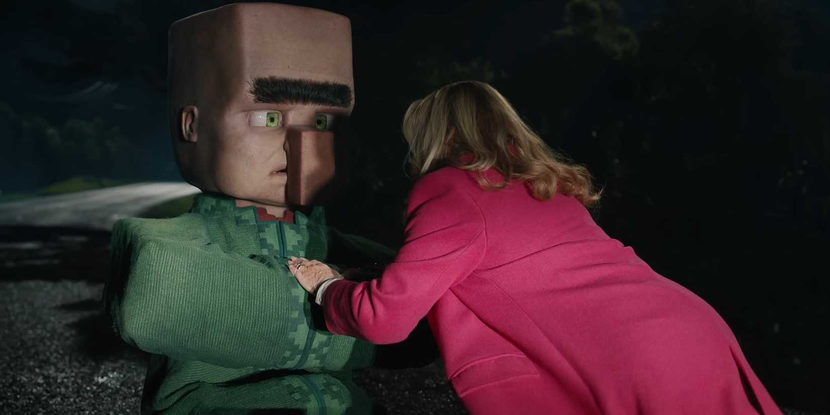 A villager sitting down next to Jennifer Coolidge in A Minecraft movie