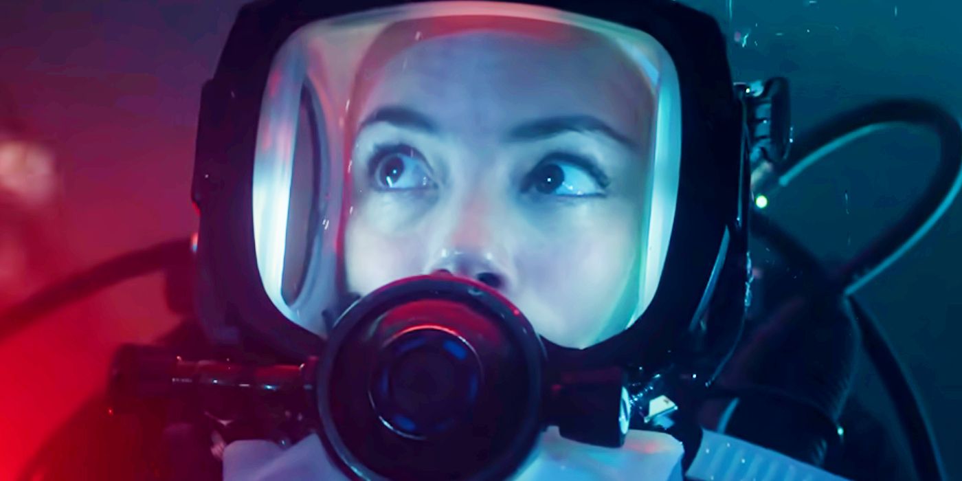 A woman underwater in a scuba mask in Under Paris