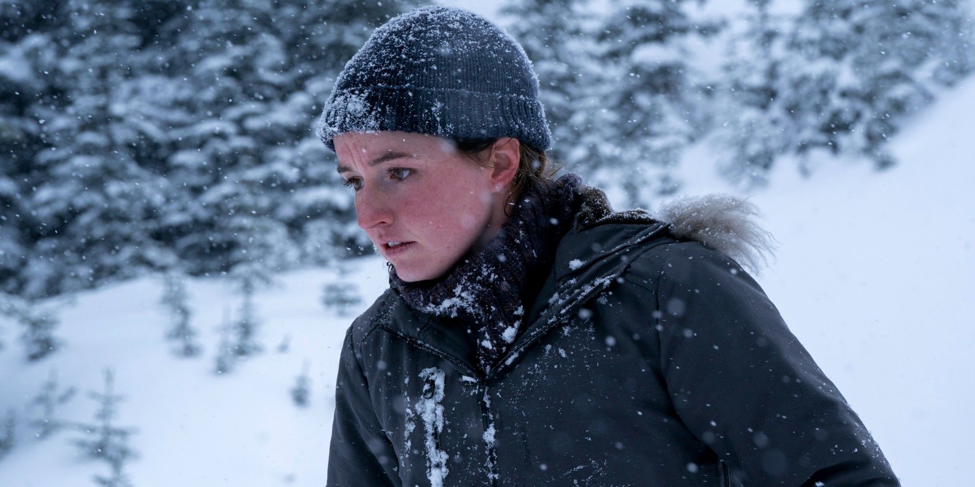 Abby caught in a snowstorm looking down in the last of us season 2