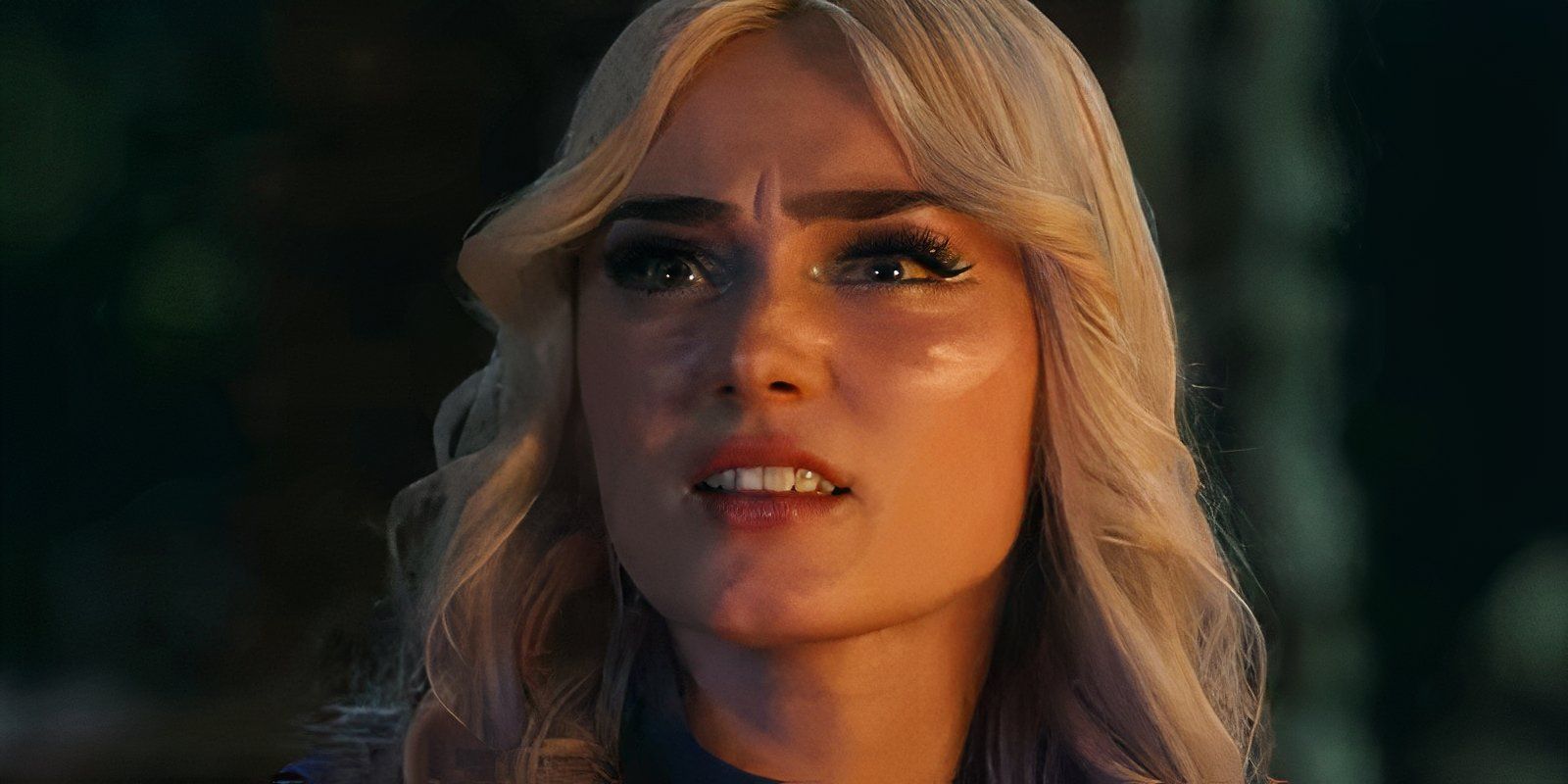 Addison is making a weird face while at the camp fire in Zombies 4
