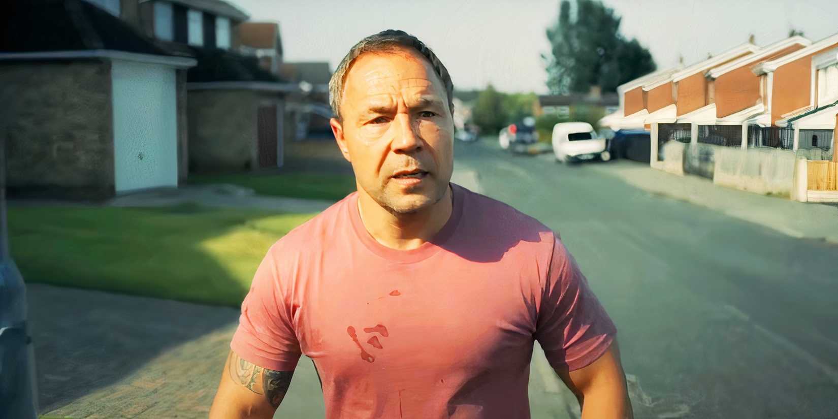 Stephen Graham walking down the street in distress in Adolescence