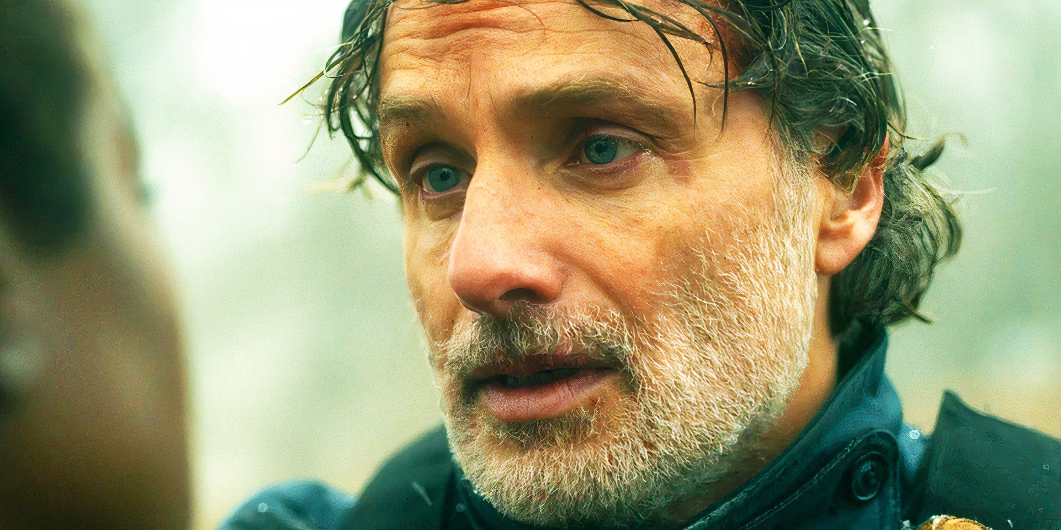 Close-up of Andrew Lincoln as Rick Grimes looking emotional in The Walking Dead: The Ones Who Live