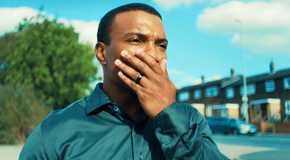 Ashley Walters with his hand over his mouth as DI Luke Bascombe in Adolescence