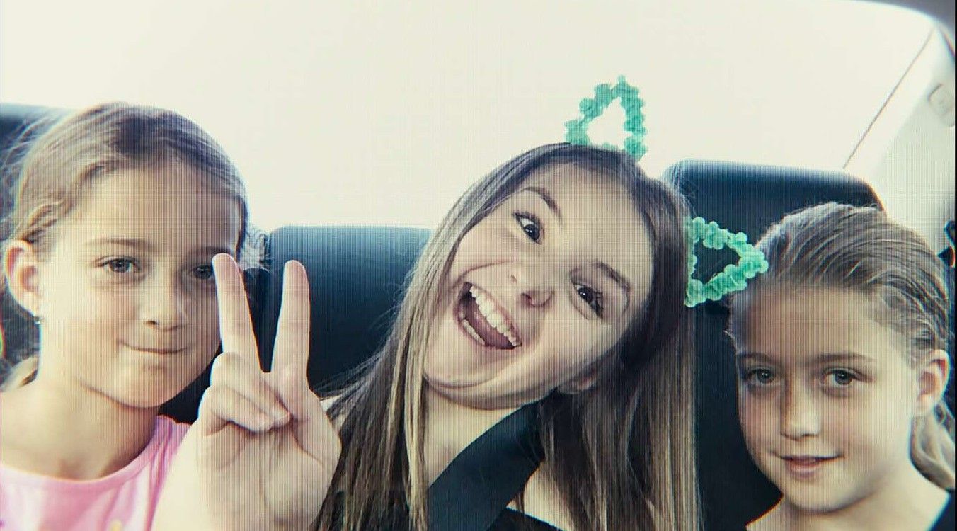 A young Claire and Reese RockSmith posing with Piper Rockelle