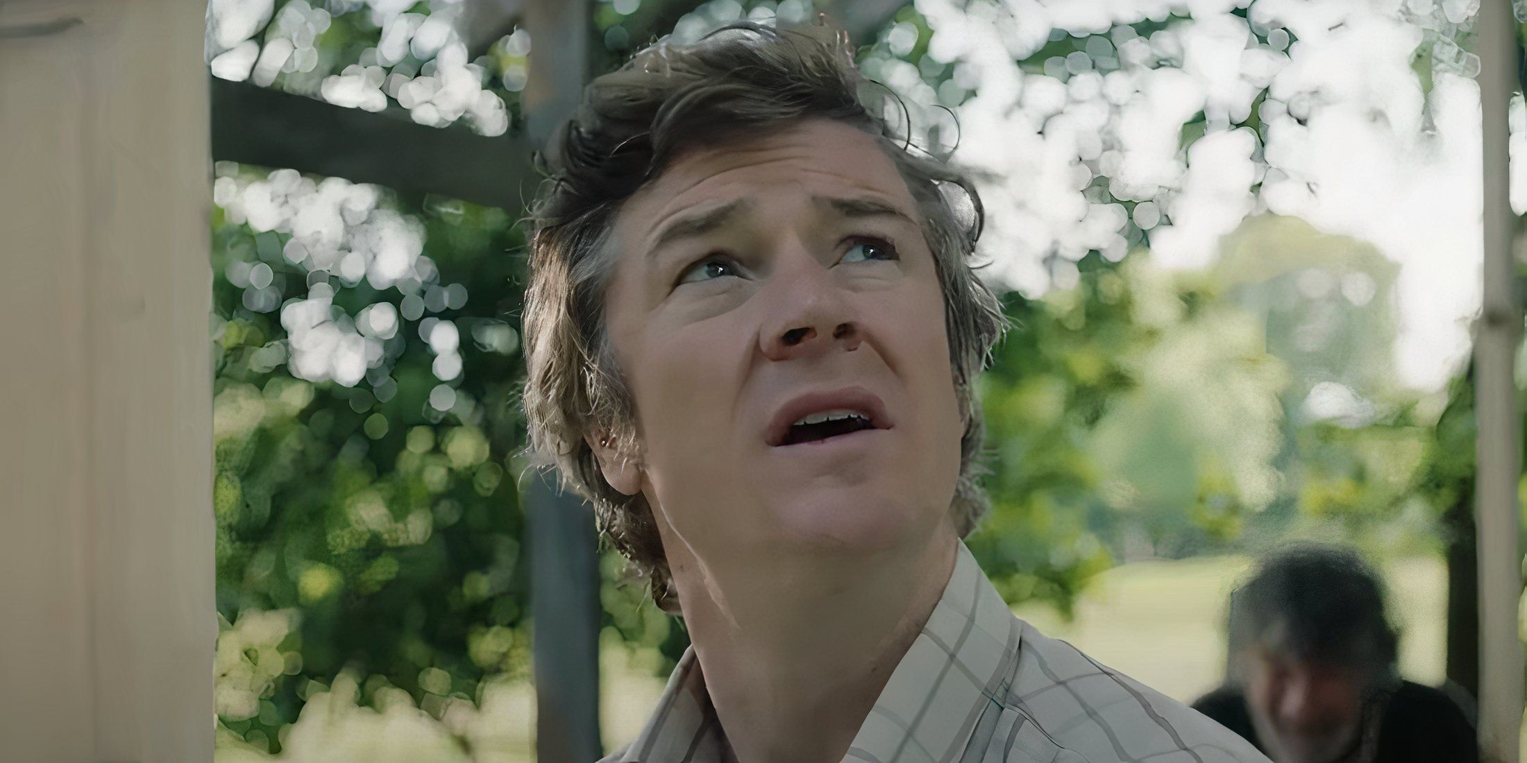 Barry Ward as Joe looking at the sky in That They May Face the Rising Sun