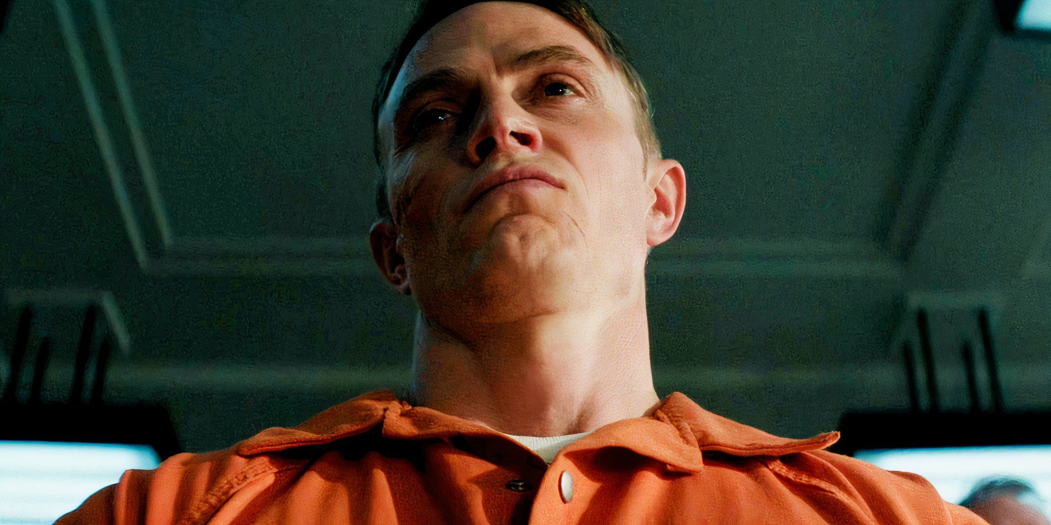Benjamin Poindexter looking indignant in a shot from below in prison scrubs in Daredevil Born Again