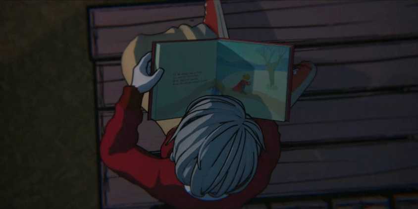 A boy reading a red book from Blue Prince.