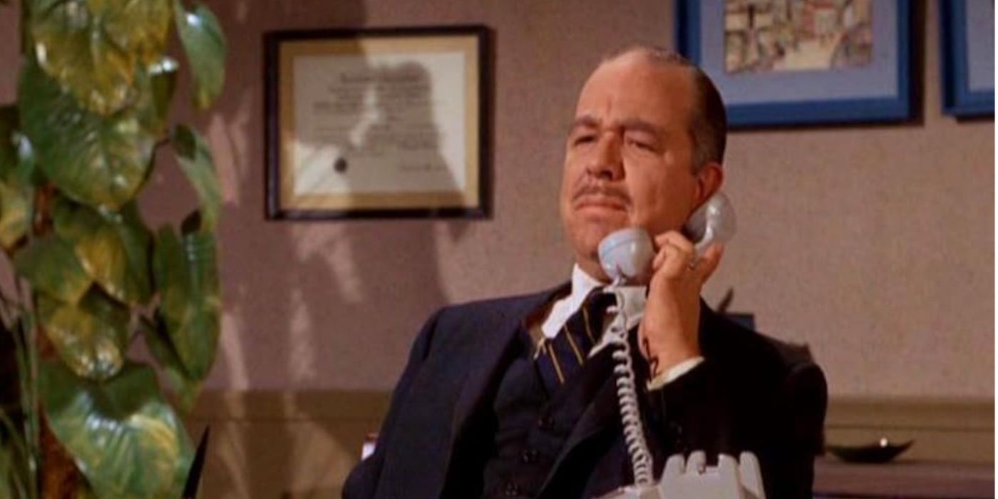 C. Lindsay Workman on phone behind desk