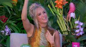 Carrie Underwood on American Idol singing along to a song with her hand raised