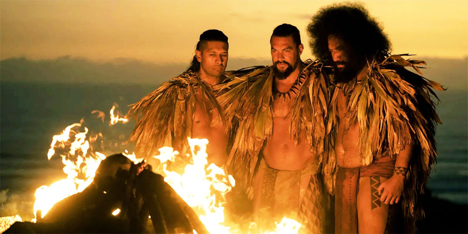 Characters gathered around a fire in Chief of War