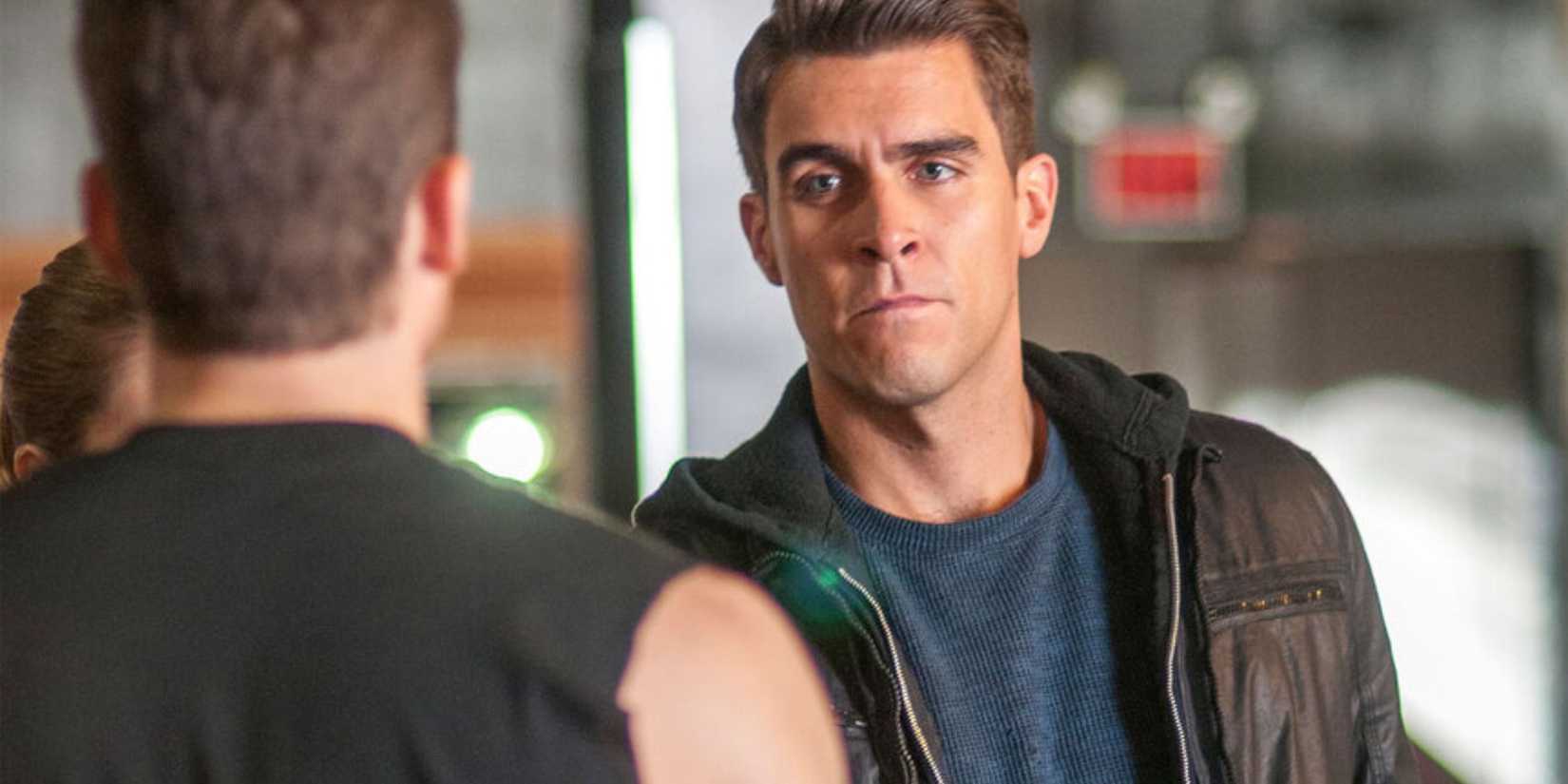 Chicago PD Justin Voight wearing a leather jacket and staring at someone