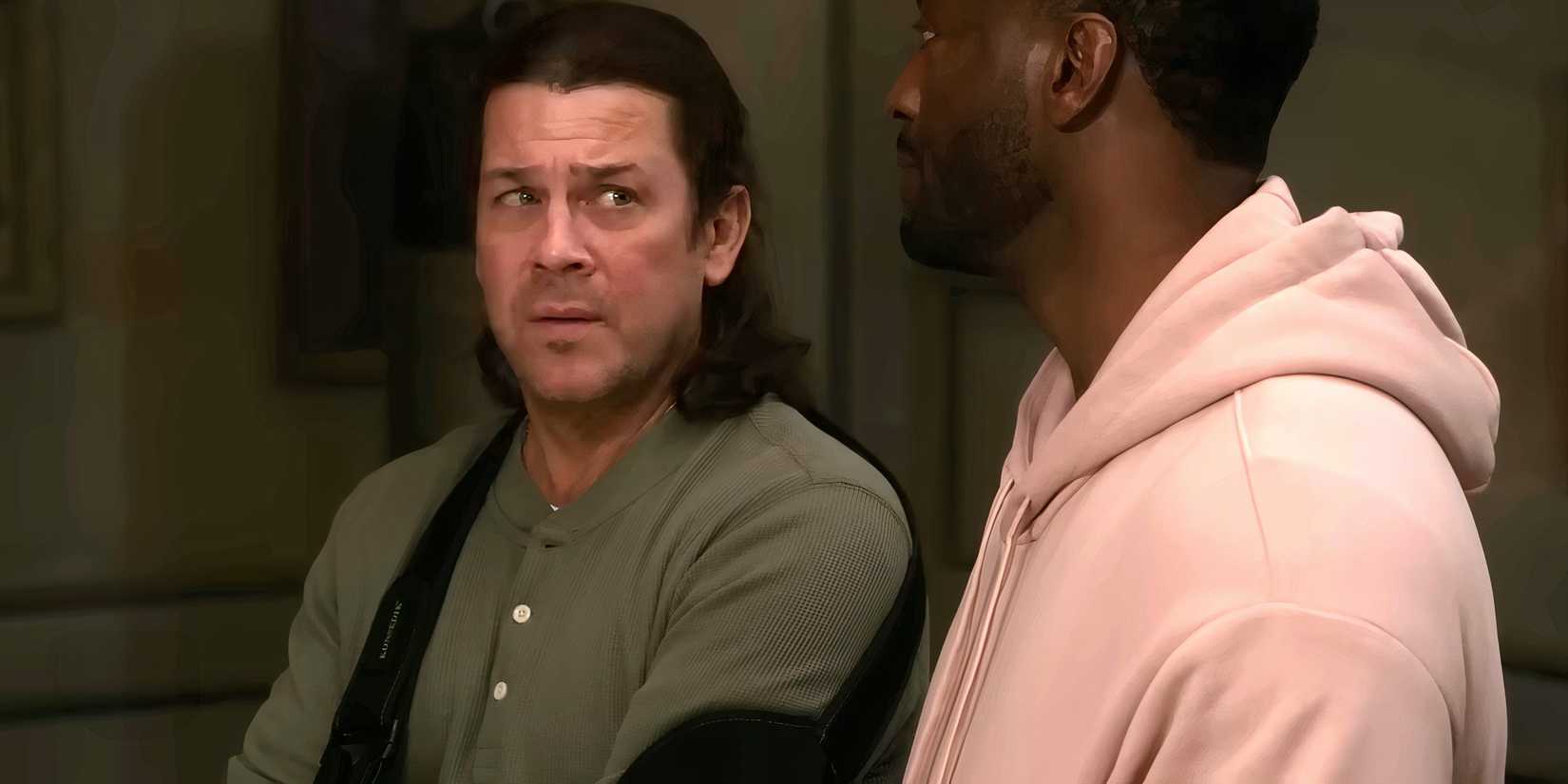 Christian Kane as Eliot looking worried at Hardison in Leverage: Redemption season 3