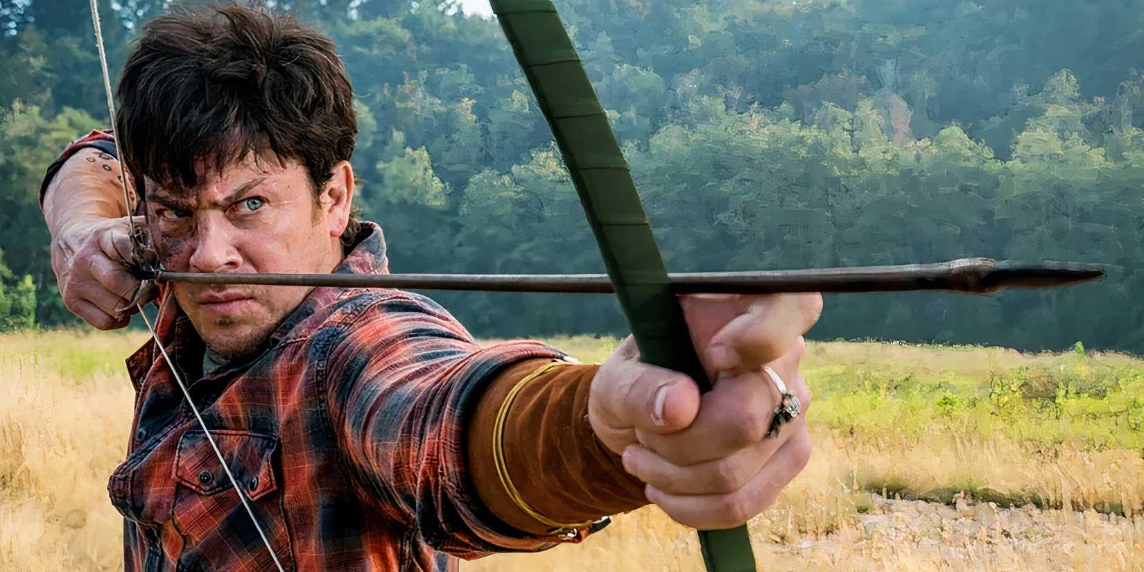 Christian Kane as Jacob aiming a bow and arrow in The Librarians