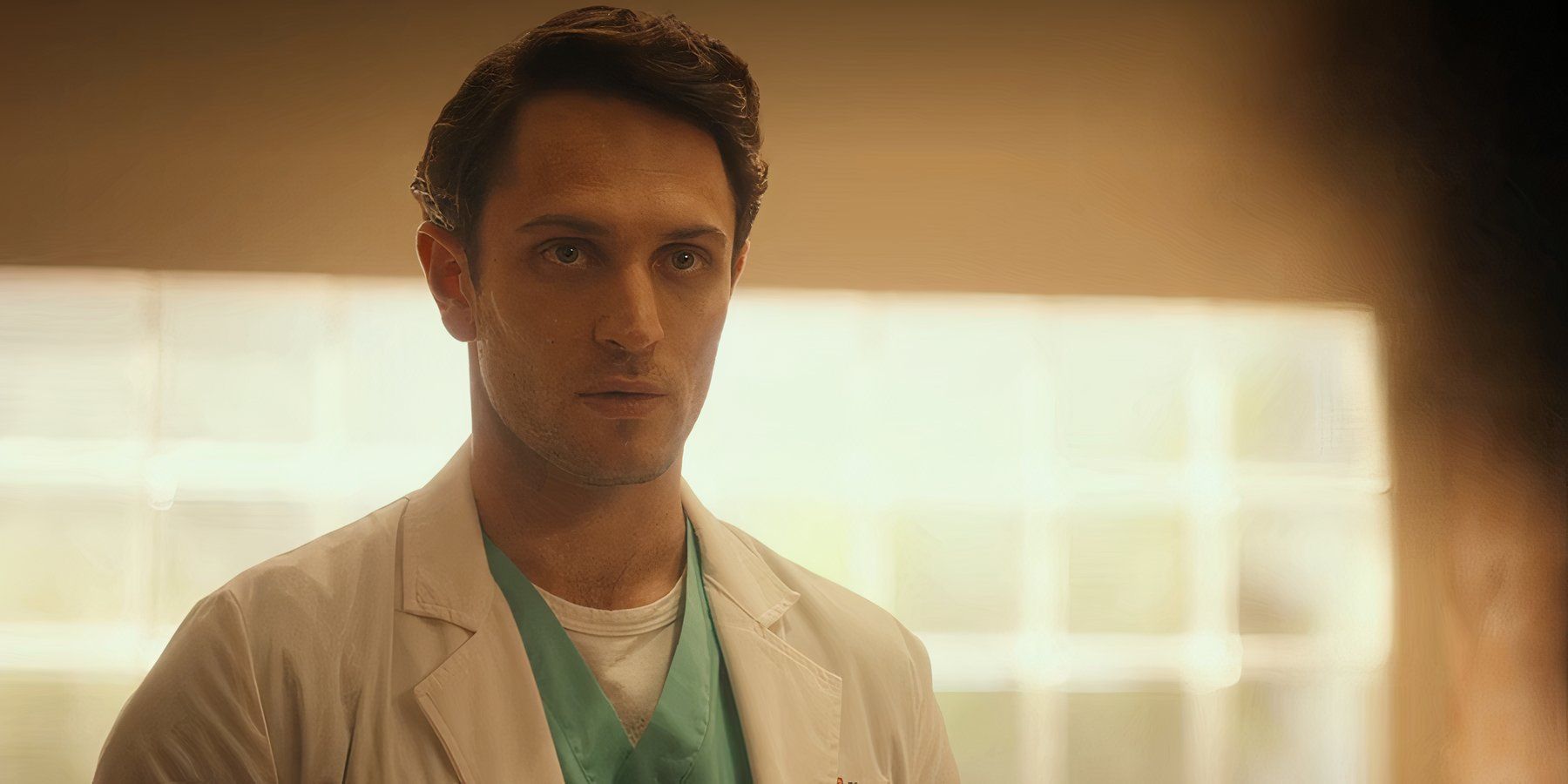 Colin Woodell as Xander Phillips looking seriously at someone off-camera in Pulse