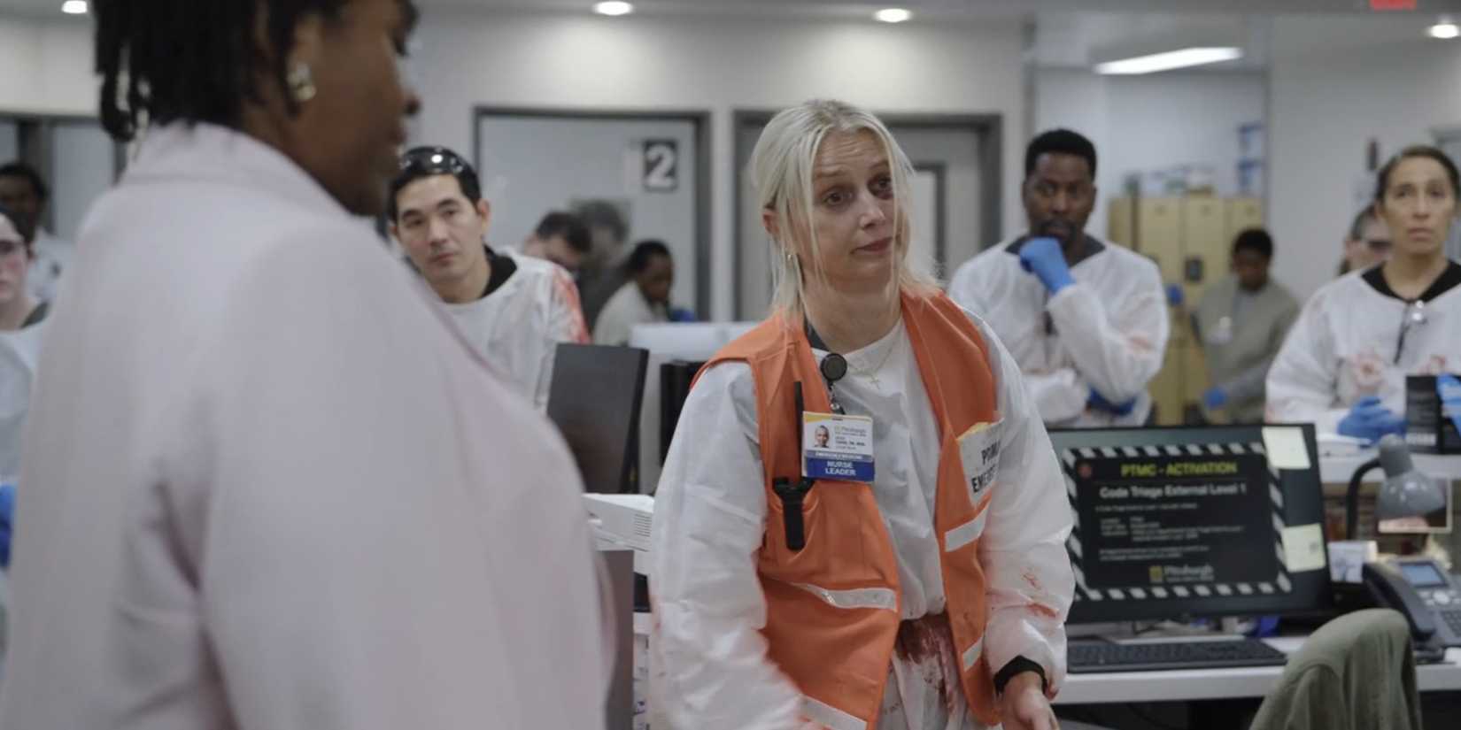 Dana Evans (Katherine LaNasa) wearing an orange vest and looking tired in The Pitt season 1, episode 14