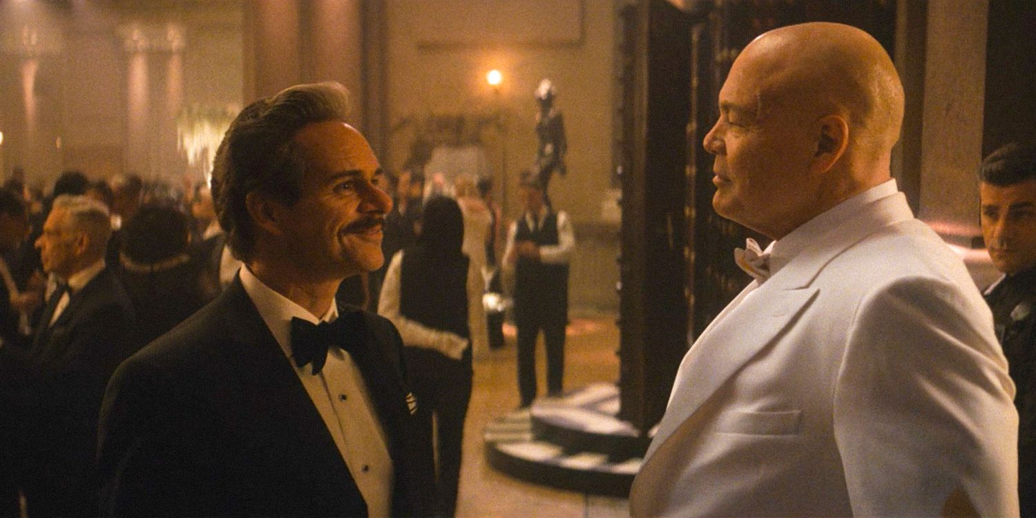 Jack Duquesne (Tony Dalton) and Wilson Fisk (Vincent D&rsquo;Onofrio) chatting happily at the Black and White Ball in Daredevil: Born Again Season 1 Ep 8