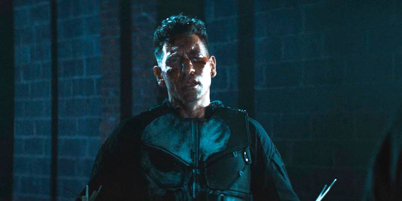 A bloodied Frank Castle / Punisher (Jon Bernthal) staring forward in Daredevil: Born Again Season 1 Ep 9