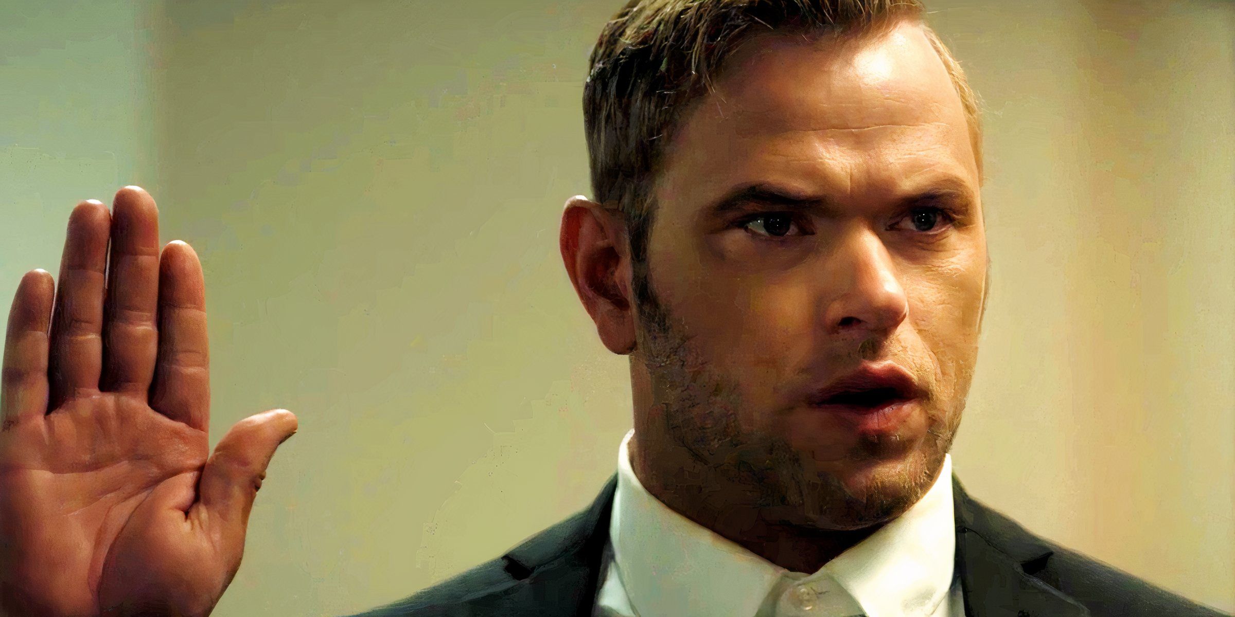 Kellan Lutz with his hand up in Desert Dawn