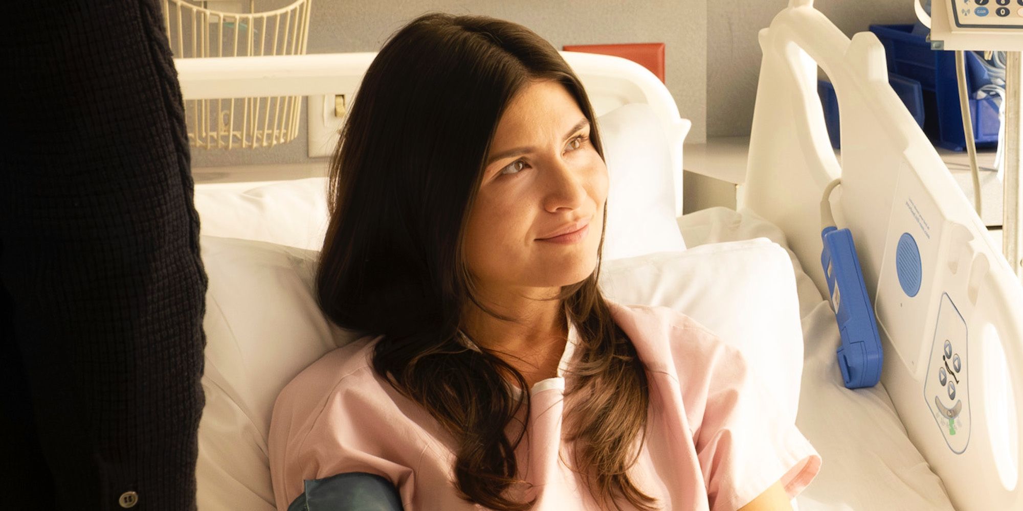 Phillipa Soo lying in a hospital bed as Avery in Doctor Odyssey episode 14.