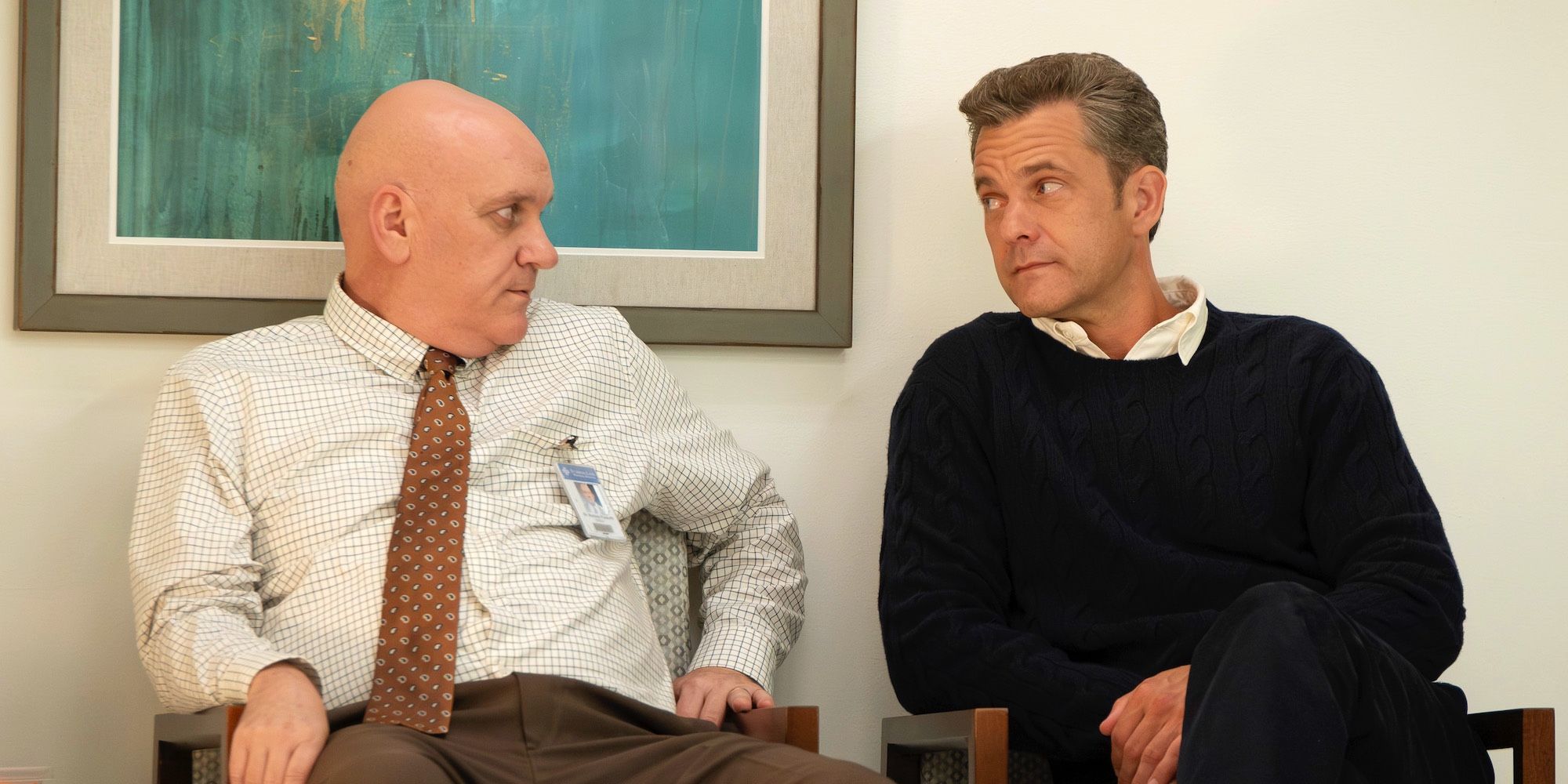 Mike O'Malley as Rodney sitting with Joshua Jackson's Max Bankman in Doctor Odyssey episode 15.
