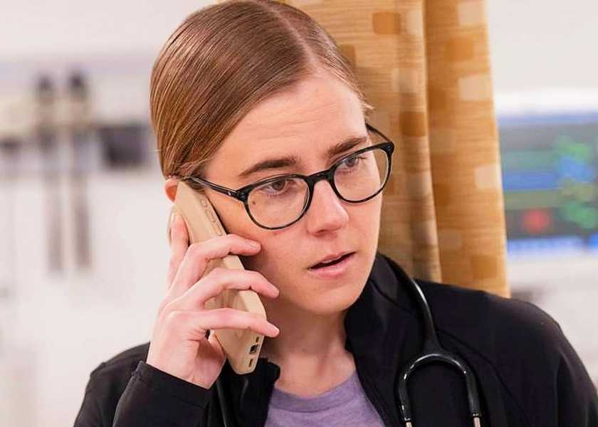 Dr. Mel King talking on the phone in The Pitt season 1