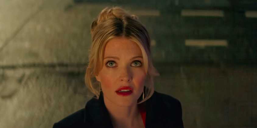 Violet (Meghann Fahy) looking up in Drop