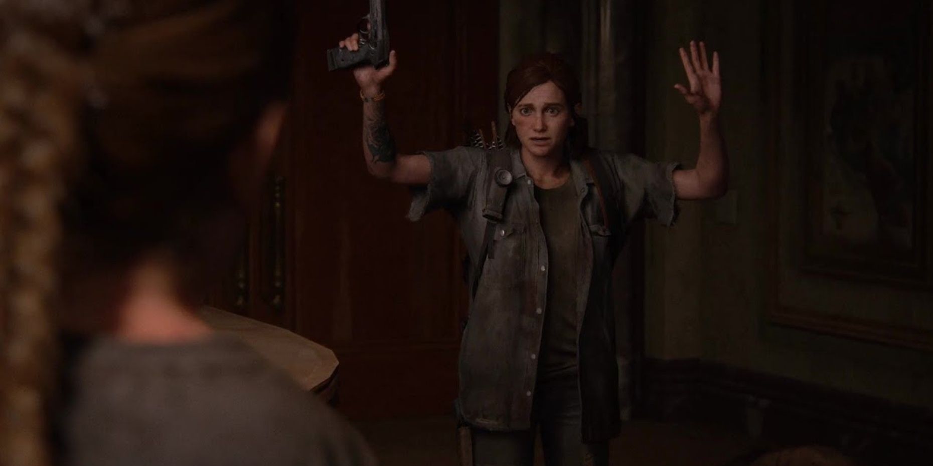 Ellie holds her arms up in The Last of Us Part II