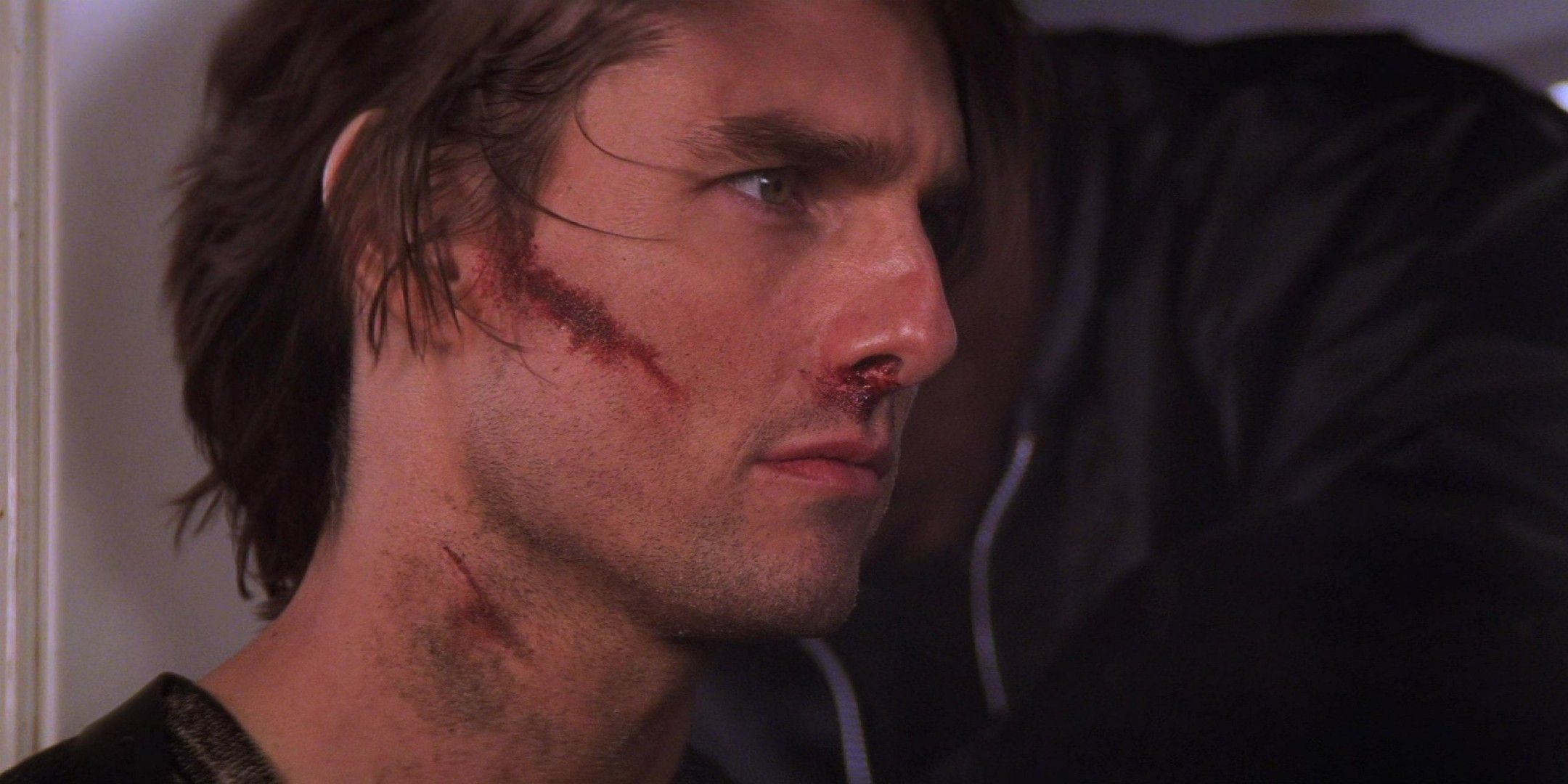Ethan Hunt with a cut on his face in Mission: Impossible 2's ending
