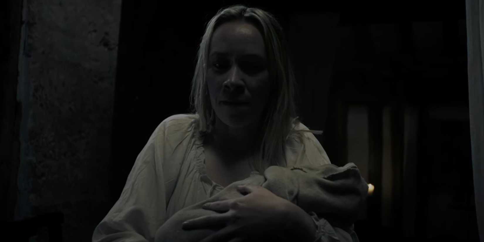Evalina holding baby in Rumpelstiltskin