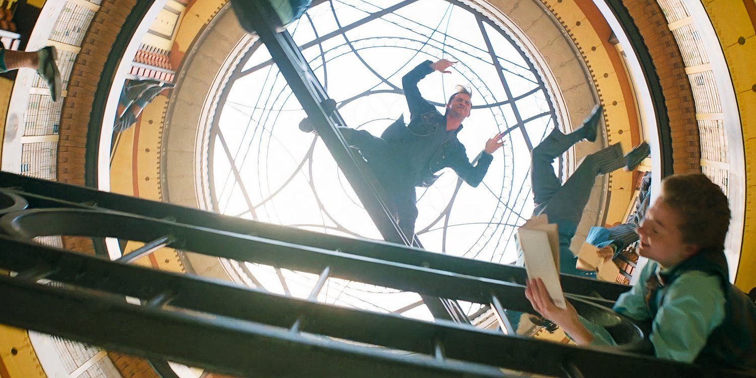 Fiyero is hanging from a ladder in Wicked's dancing through life musical number