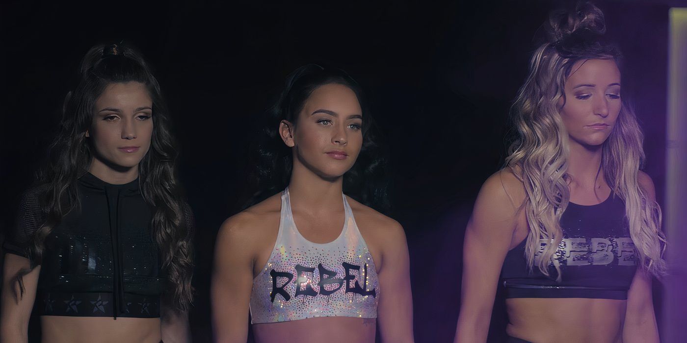 Gabi Butler on Netflix's Cheer wearing a cropped white tank that says Rebel