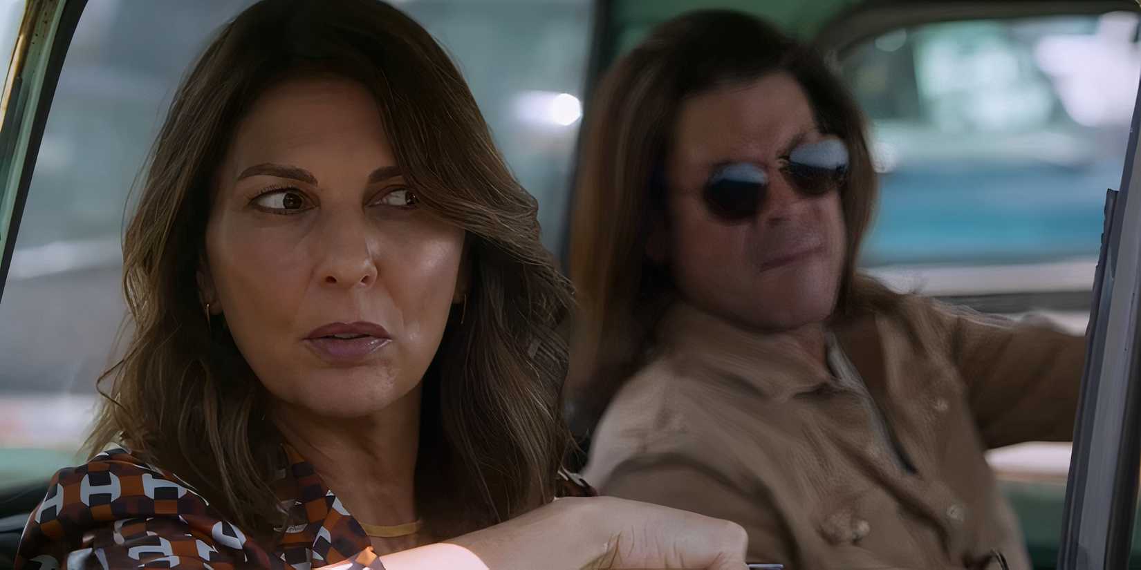 Gina Bellman's Sophie and Christian Kane's Eliot looking suspicious while in a truck in Leverage: Redemption season 3