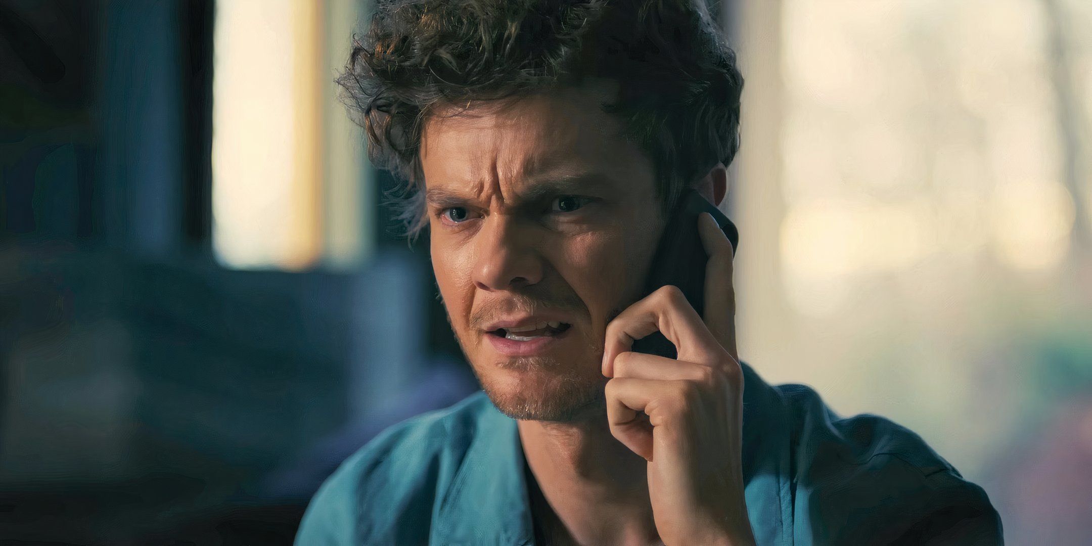 Jack Quaid as Josh looking upset while on the phone in Companion
