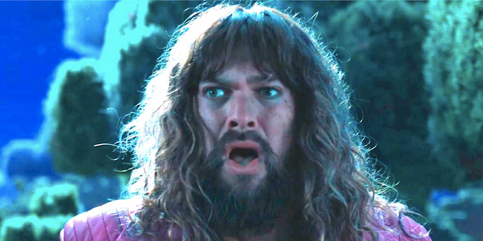 Jason Momoa's Garrett “The Garbage Man” Garrison looks shocked at night in A Minecraft Movie