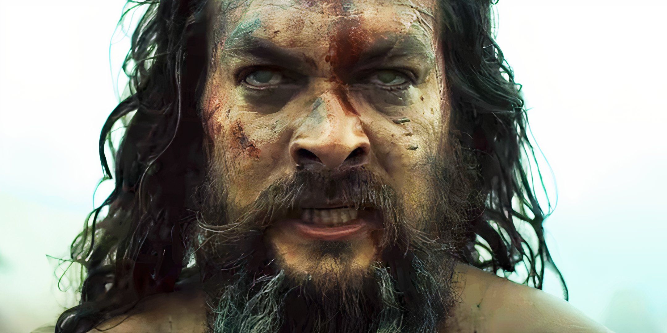 Close-up of Jason Momoa staring intensely forward in See