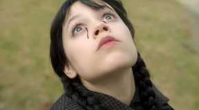 Jenna Ortega as Wednesday looking to the sky with her eyes bleeding black in Wednesday season 2