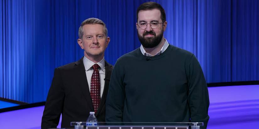 Jeopardy Contestant Andrew Hayes Standing Next To Host Ken Jennings