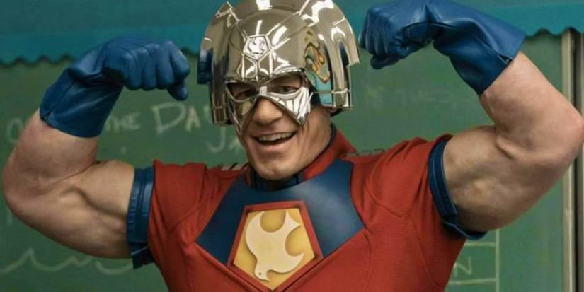 Christopher Smith/Peacemaker (John Cena) flexing his muscles in Peacemaker season 1