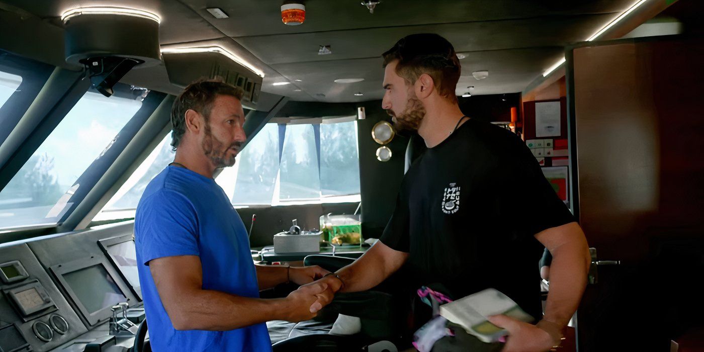 Below Deck Down Under&rsquo;s Captain Jason Chambers and Johnny Arvanitis shake hands in the captain&rsquo;s lounge