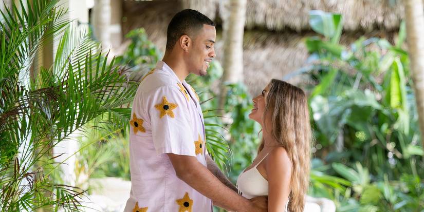 The Bachelor's Juliana Pasquarosa and Grant Ellis facing each other and looking into each others eyes