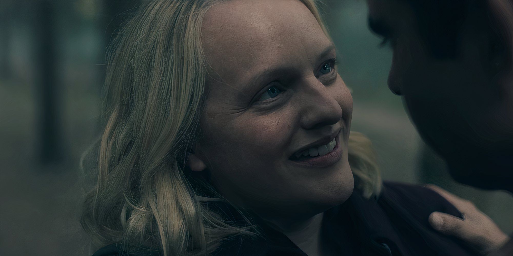 June (Elisabeth Moss) looking happy in The Handmaid's Tale