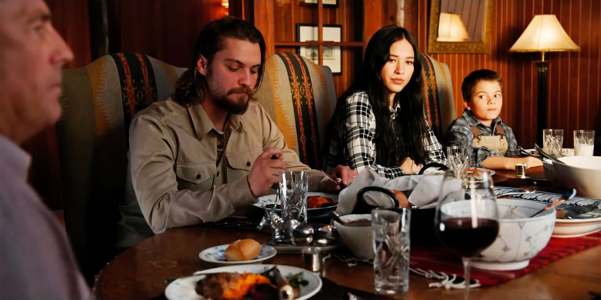 Kayce Monica and Tate eat at the dinner table in Yellowstone