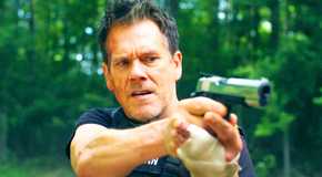 Kevin Bacon pointing a pistol in The Bondsman