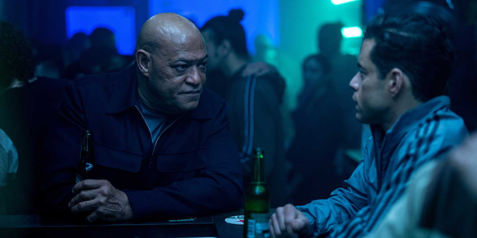 Laurence Fishburne & Rami Malek at a bar in The Amateur