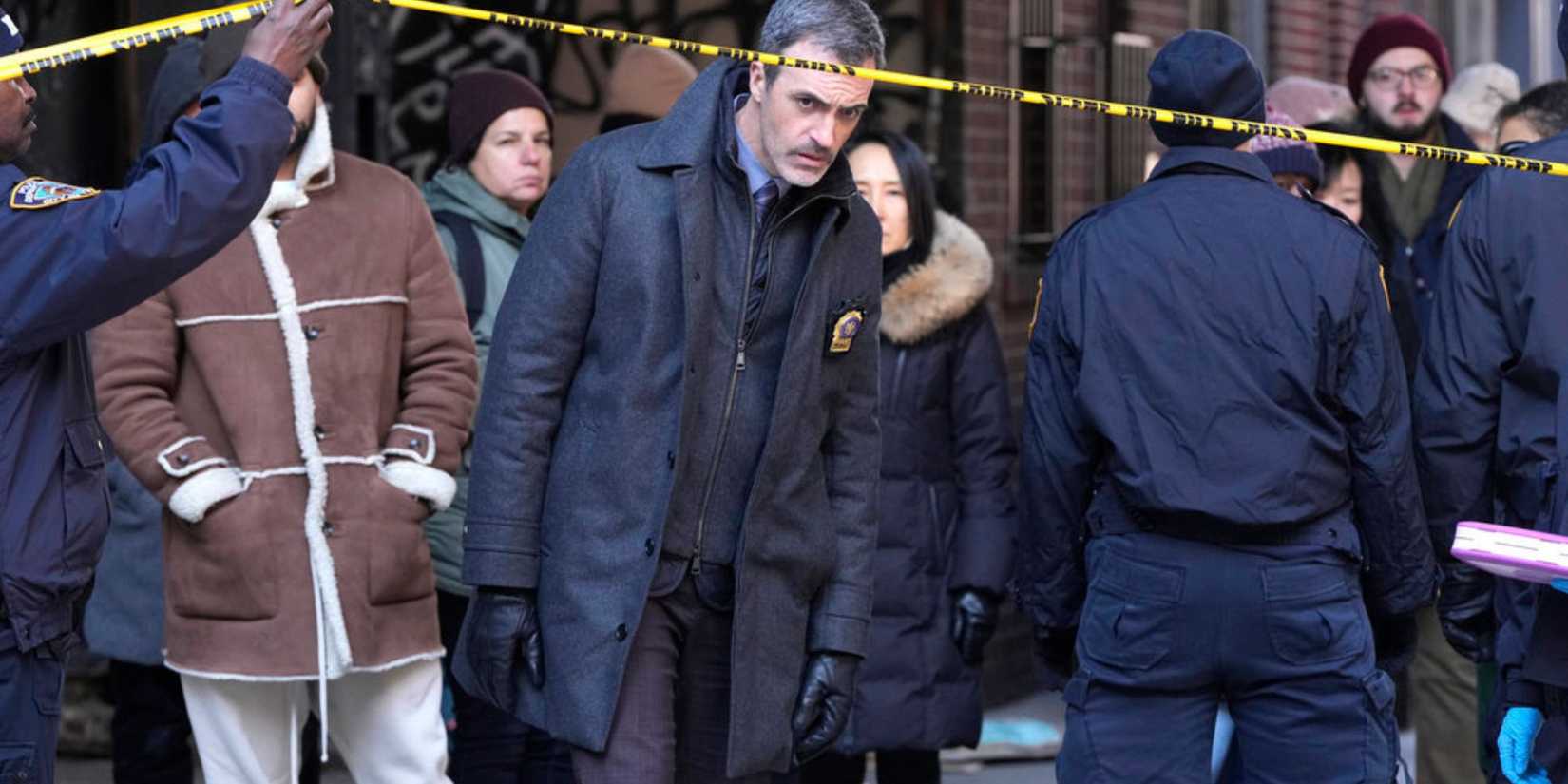 Law & Order Riley ducking under the crime tape at the scene of a murder
