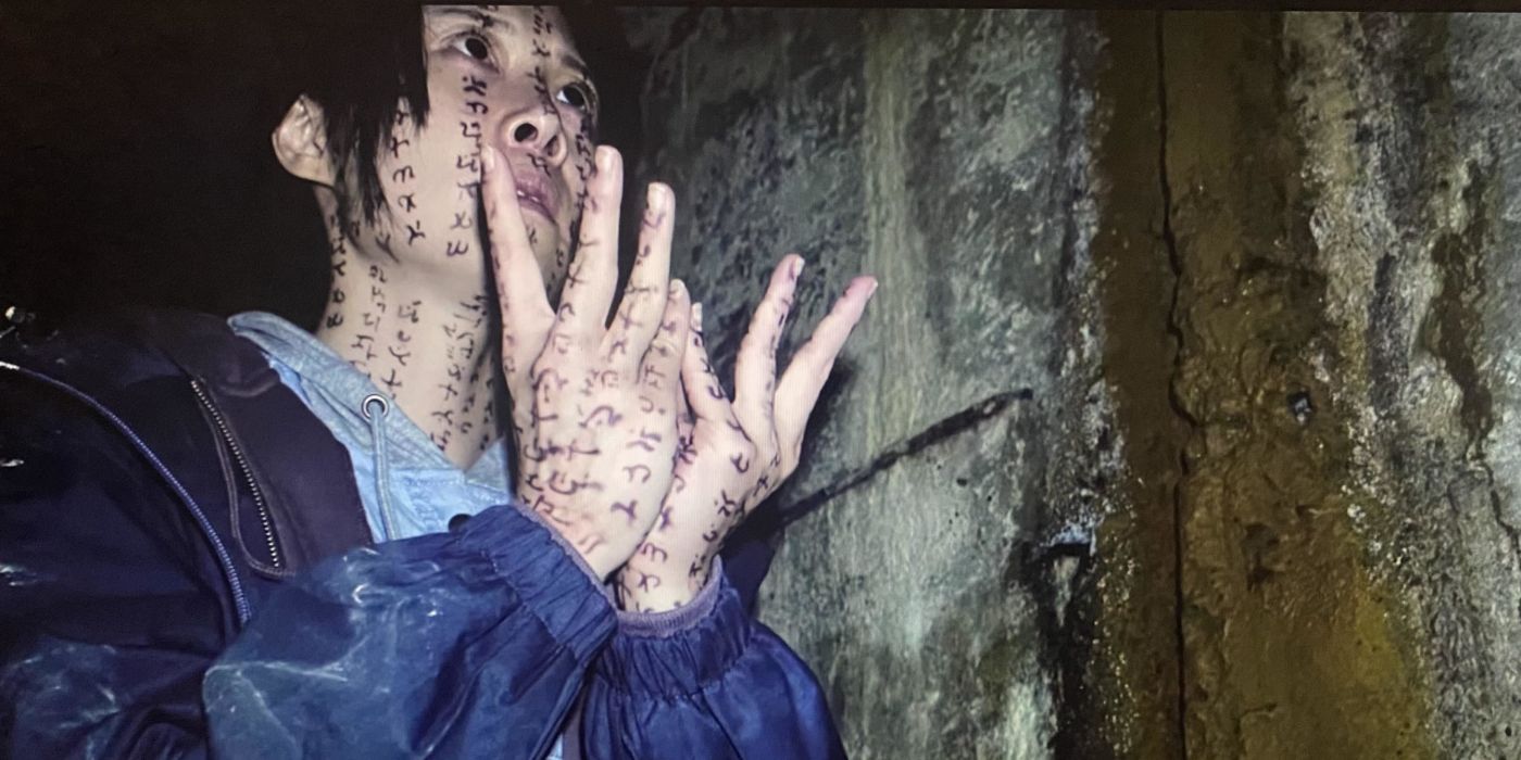 Li Ronan (Tsai Hsuan-yen) covered in symbols in Incantation.