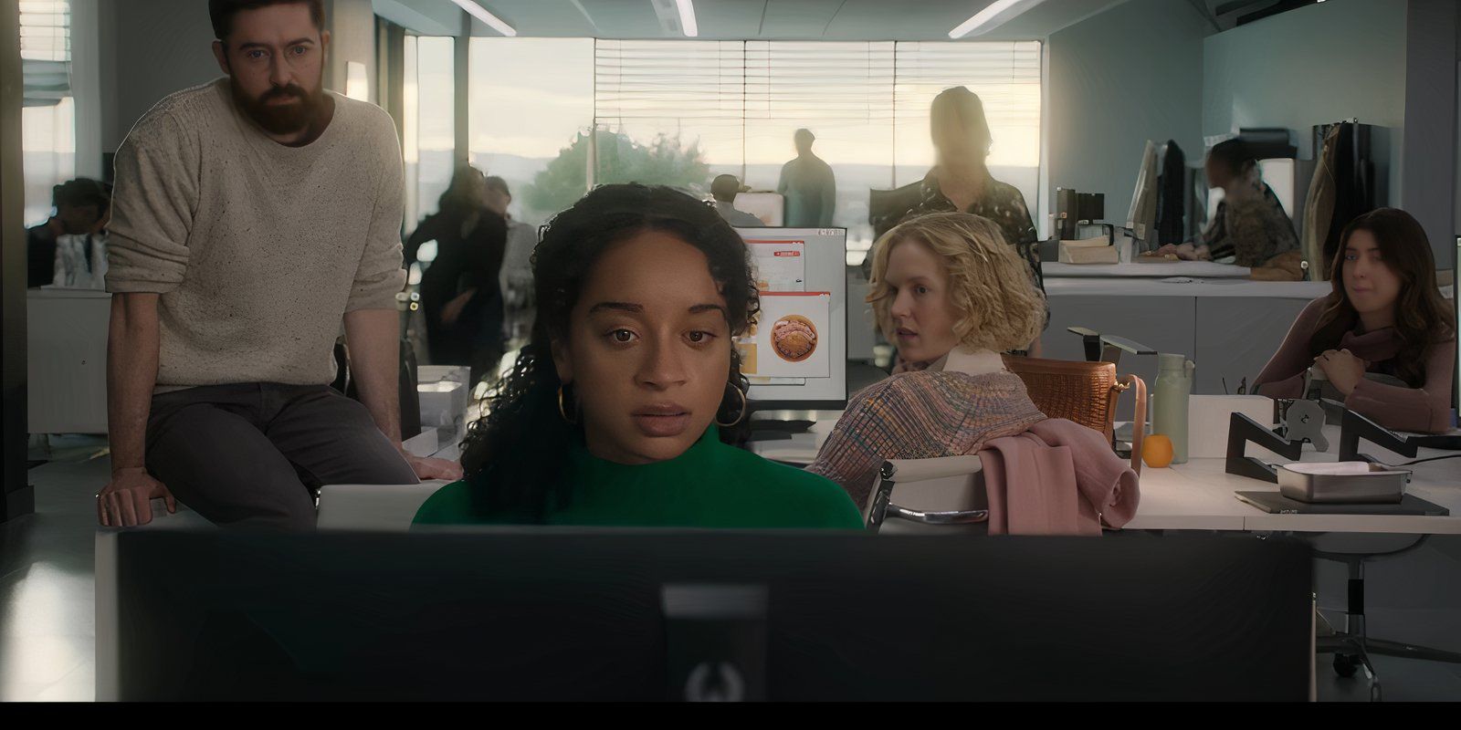 Marie looking at her computer while Verity and other characters look back at her in Black Mirror Bete Noire
