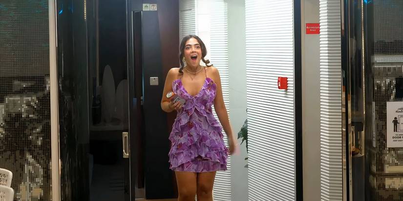 Below Deck Down Under's Marina Marcondes de Barros wearing a purple dress and looking surprised