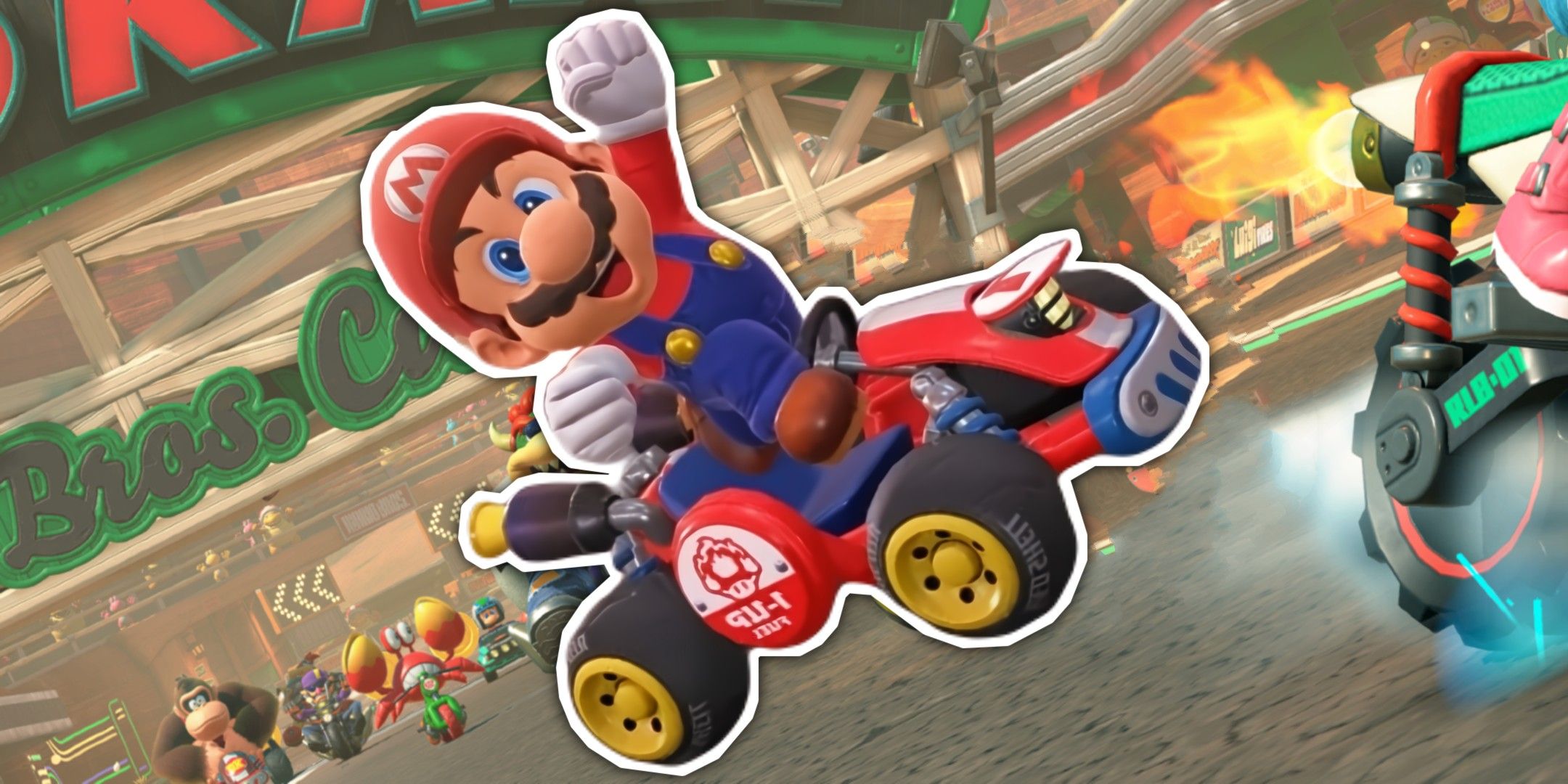 Mario Kart World Mario in his kart in front of a speedway.