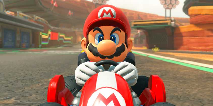 Mario on his racing kart in Mario Kart World.